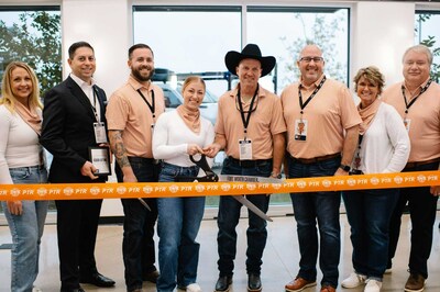 PTR's leadership team cuts ribbon alongside a Fort Worth Chamber of Commerce representative, celebrating the opening of their DFW facility.