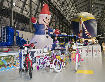 Holiday decor and toys on display in front of the Goodyear Blimp during a past U.S. Marine Corps Reserve Toys for Tots donation drive.