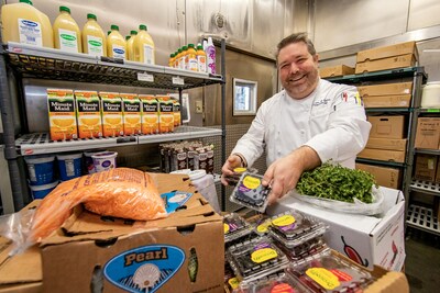 Disneyland Executive Chef Adam Brown prepares food donations for Second Harvest Food Bank.