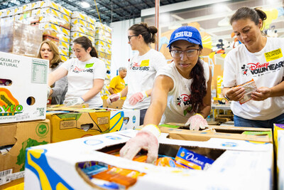 Walt Disney World VoluntEARS package food donations for Second Harvest Food Bank of Central Florida.