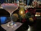 Peppermint martini with holiday decorations.