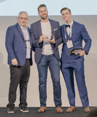 EquitySet CEO Tony Zipparro (center) accepts the award for Best Investment Research Tech from Benzinga