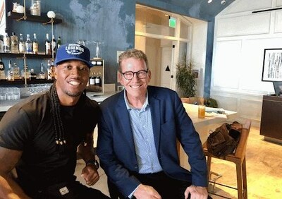 Darnell Ferguson, host of SuperChef Grudge Match, with Adam Christing