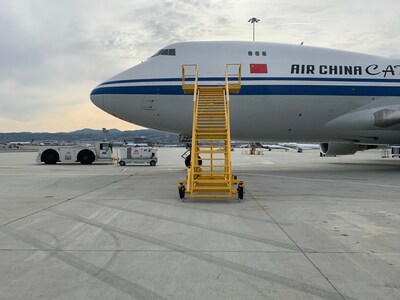 A Mercury GSE JBT Pushback Tractor and TLD Ground Power Unit, servicing an Air China Cargo 747, on the tarmac at San Francisco International Airport (SFO) in support of the APEC Conference.