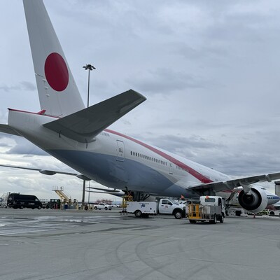 A Japanese government airplane being serviced by Alliance Ground International  using Mercury GSE ground support equipment, including Stinar service vehicles, on the tarmac at San Francisco International Airport (SFO) in support of the APEC Conference.