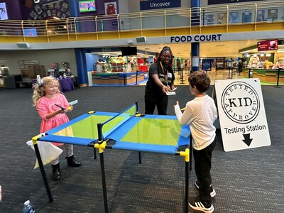 Table tennis was the game to go back and forth but kids got to try out all kinds of toys to determine what they will put on their holiday lists.