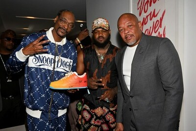 The 3rd annual ASCAP Foundation Holiday Auction features items for bid including multiple pairs of custom Air Force Ones signed by Dr. Dre & Snoop Dogg. Olivia Rodrigo, Selena Gomez, Travis Barker, Chris Stapleton and more have also donated items to the auction which benefits programs that support the next generation of songwriters. In photo: Dr. Dre & Snoop Dogg with shoe artist Frankie Zombie and the custom Air Force Ones (credit: Lester Cohen, Getty Images for ASCAP)