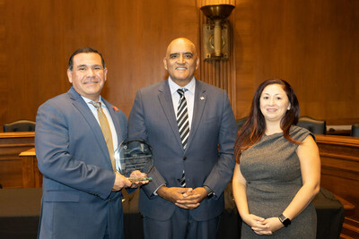 TxDOT Deputy District Engineer Mike Arellano and a colleague receive the 2023 National Roadway Safety Award from Federal Highway Administrator Sheilan Bhatt.