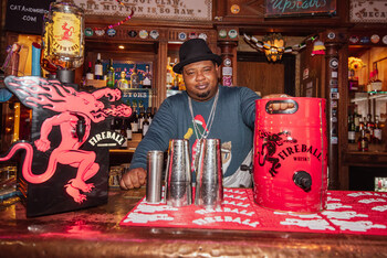 Big Narstie served up shots of Fireball Cinnamon Whisky Liqueur from the FireKeg at the Cat and Mutton Pub - Photo Credit KG Media (PRNewsfoto/Fireball)