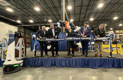 Axcelis Logistics Center grand opening ribbon cutting ceremony. From left to right:  Chris George, Chief Manufacturing Officer; Kevin Brewer, EVP Finance and Manufacturing; Russell Low, President and CEO; Kais Doghri, Director of Operations; Carl Stankiewicz, Director of Operations