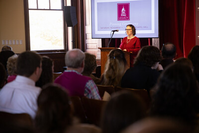 Ainsley Callahan Spellings (class of 2000) reads a message of blessing to FHU families at the Legacy Pinning Ceremony.