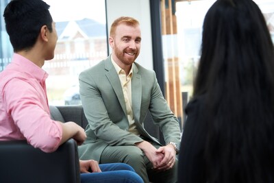 Chris Preston (He/Him), Director of Customer Experience, connects with his colleagues in informal gathering spaces at Mattamy Homes. (CNW Group/Mattamy Homes Limited)