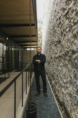 Jeff Garnett in the intentional space between his studio and the historical building next door (photo by Hannah Middleton)