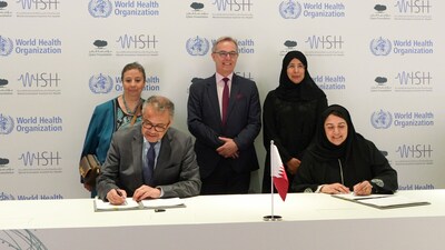 Dr Tedros Adhanom Ghebreyesus (seated left) , Director General, WHO, and Sultana Afdhal, CEO, WISH, sign a collaboration agreement at Qatar Foundation's headquarters, witnessed by Her Excellency Dr Hanan Mohamed Al Kuwari (top right), Minister of Public Health in Qatar, and representatives of WHO.