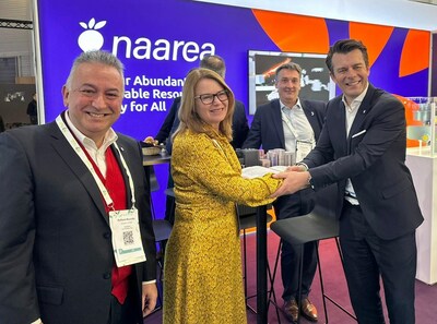 Raffaele Muscetta (left) and David Briggs (right), from Naarea, celebrate the signing of the framework contract with Dawn James and Philippe Wolf from Jacobs at the World Nuclear Exhibition in Paris.