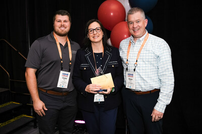 The Designery North Raleigh owners Dana and Anne-Louise Merrill, right and middle, pose with their CARES Award with The Designery President Casey Ridley, left, at HomeFront Brand's recent franchisee convention.