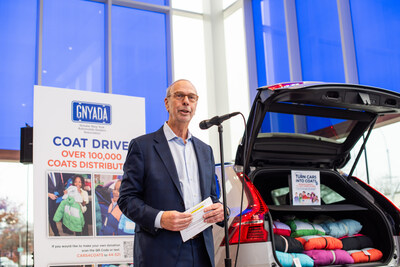 Cars for Coats: Greater New York Automobile Dealers Association President Mark Schienberg helps kick-start the organization's Annual Winter Coat Drive for Kids.