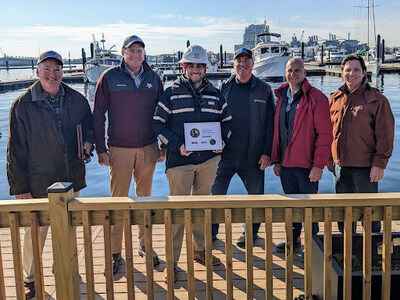 Monument Senior Project Manager, Brendan Quirk, sharing the Marina of the Year award with the Dissen & Juhn marine construction and Moffat Nichol engineering teams