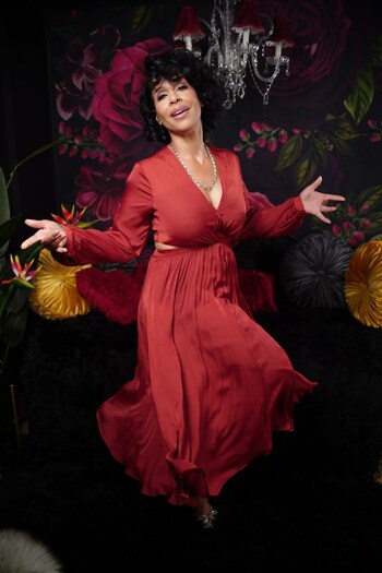 Tamaira "Miss Tee" Sandifer is "Dancing Into Fif-Tee" (Credit: STAE media; full body image; Miss Tee dances wearing a red flowy dress)
