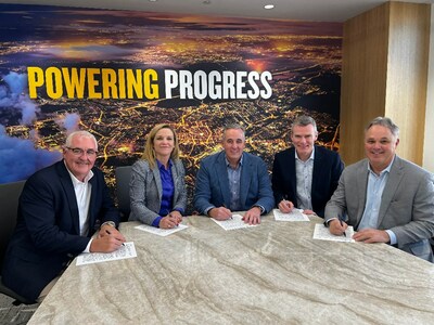 Executives from CRH sign the agreement with Caterpillar Group President Denise Johnson at the company's headquarters in Irving, Texas.