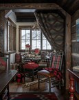 The Kibler & Kirch-designed Christmas cabin’s breakfast nook becomes a holiday wrapping studio with the addition of a Ralph Lauren blanket to keep preparations secret (PC: Audrey Hall).
