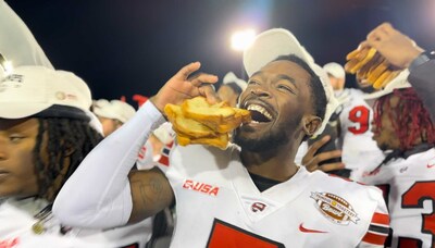 Western Kentucky University celebrates thrilling overtime win at Famous Toastery Bowl. Players ate toast by the fistful, made toast-angels on the field, and threw slices of bread into the air to mark their victory.
