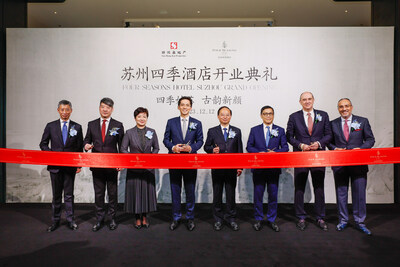 Dignitaries cut the ribbon for the grand opening of Four Seasons Hotel Suzhou