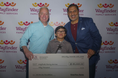 Wayfinder Family Services President and CEO Jay Allen and Stevie Wonder's We Are You Foundation CEO Aundrae Russell presented Lucas Pelayo with the Stevie Wonder Star Student award.