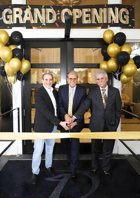 Board President Dave Kaplan, General Manager/COO Robin Blankhorst, and Vice President Michael Samakow proudly cut the ribbon at the grand opening of the newly renovated clubhouse at Delaire Country Club.