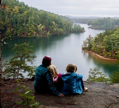 A family enjoying the view from Keowee Toxaway State Park in South Carolina.