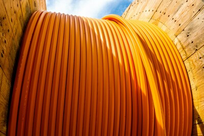 Orange fiber optic cable spool