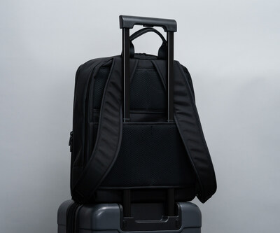 Convenient wheeled-suitcase handle passthrough