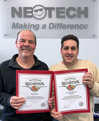 Craig McCrary and Nick Abrahms proudly display their certificates.