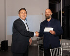 ESM Managing Partner Dave Hassard presenting a donation to Adam Jaeger of the Hudson County Boys and Girls Club
