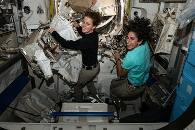 (Nov. 3, 2023) NASA astronauts and Expedition 70 Flight Engineers Loral O'Hara, left, and Jasmin Moghbeli, right, work on a spacesuit aboard the International Space Station's Quest airlock. Credits: NASA