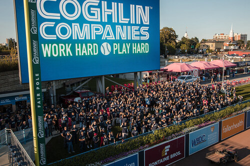 Coghlin Companies brings together Caring Associates, company executives, and members of the Coghlin family to celebrate and live the motto of 'Work hard, play hard,' at Worcester's Polar Park.