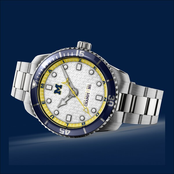 Hail to the Victors! The Michigan 2023 National Champions Timepiece by AXIA Time is a Swiss made automatic diver watch with  water resistance to 200 meters. It comes in a 43.5 mm stainless-steel case and bracelet with two additional straps, school color-matched nylon NATO and rubber, and complimentary custom engraving. Through the end of January, fans can select to receive a free commemorative wood display box or $100 off a watch.