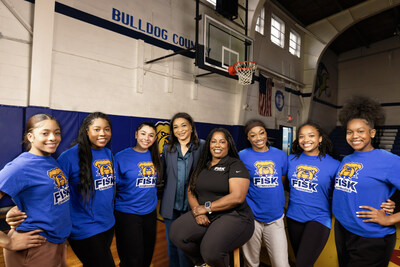 Fisk University gymnasts with head coach Corrinne Tarver and Unilever executive Dawn Williams-Thompson.
