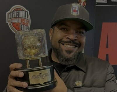 Ice Cube holding the inaugural Naismith Hall of Fame Ice Cube Impact Award