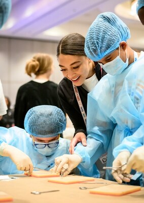 Students practice suturing skills at VMX 2024's blendVET event.