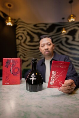 Humberto Leon showcasing his original designs on the back of the limited-edition D'USS XO x Humberto red envelope, and a bottle of D'USS XO.