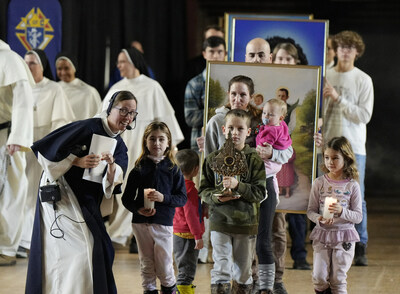 Young people and other guests gather for Life Fest, organized and co-sponsored by the Knights of Columbus and Sisters of Life. The event took place Jan. 19, 2024, at the D.C. Armory before the annual March for Life in Washington. / A Sister of Life directs the family processing into Mass with relics of Jzef and Wiktoria Ulma and their seven children. The Ulmas, who were killed in 1944 for harboring Jews, were beatified in Poland in September. Relics of St. John Paul II, Blessed Carlo Acutis and Blessed Michael McGivney, founder of the Knights of Columbus, were also present at Life Fest. (Photo by Paul Haring/Knights of Columbus)
