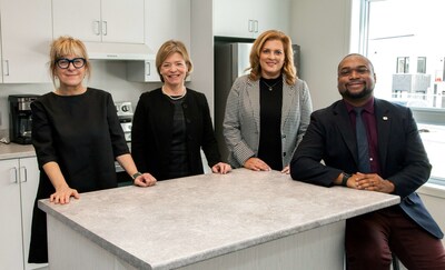 From left to right, Denise Godbout of Habitations L'querre, lisabeth Brire, Member of Parliament for Sherbrooke, Genevieve Hebert, MNA for Saint-Francois and Assistant Government whip, and Ras Kibonge, Deputy Mayor of Sherbrooke. (CNW Group/Canada Mortgage and Housing Corporation (CMHC))