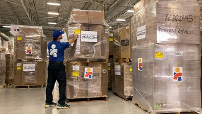 Workers in Americares Global Distribution Center in Connecticut prepare 6 tons of medical aid for the Dominican Republic—one of the organization’s first donated shipments through the Containers of Hope program. Photo courtesy of Americares.