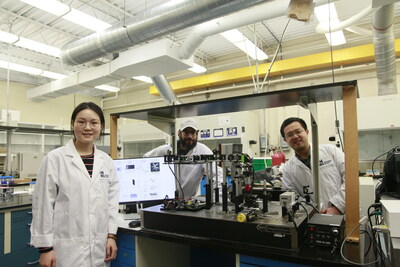 Study’s first author Miao Liu, a Ph.D. student in energy and materials science supervised by Professors Jinyang Liang (right) and Fiorenzo Vetrone (left) in their laboratory at the INRS. The team has developed a new technique that pushes back some of the limits of the infrared imaging of rare-earth doped nanoparticles. This groundbreaking discovery paves the way for promising applications, particularly in the biomedical and information security fields. 
Photo credit: INRS (CNW Group/Institut National de la recherche scientifique (INRS))