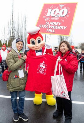 Worth the wait! After waiting in line for more than 20 hours, dedicated fan Cristina Aguirre (left) celebrates her coveted status as the day’s first official customer at Jollibee’s Jan. 25 opening in Surrey, BC, Canada, which marked its 100th store in North America; she is joined by Maribeth Dela Cruz, President Jollibee N.A. (right). (Photo credit: Jollibee)