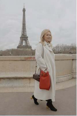 Irina Titova-Kashan, Founder of Sattaché, pictured with The Classic Bag in Rouge.