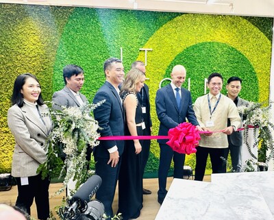 Bert Bean, CEO, cuts ribbon on new facility in opening ceremony in Manila, Philippines.