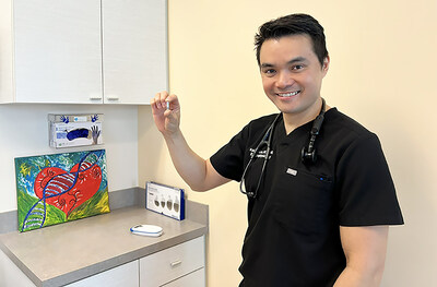 Dr. Kelvin Lau holding the most advanced leadless pacemaker, the Micra AV2.