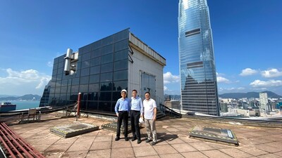 Thomson (on the left) and the team were responsible for the installation of solar panels on a prominent landmark building in Hong Kong.